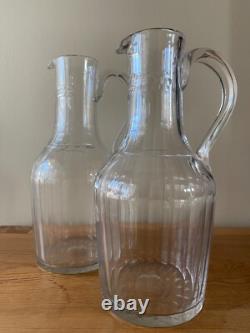 2 anciennes Verseuses / Carafes en cristal taillé et gravé d' 1 couronne