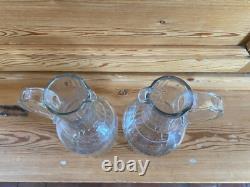 2 anciennes Verseuses / Carafes en cristal taillé et gravé d' 1 couronne