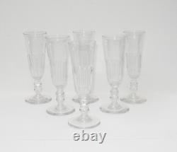 Six anciennes flûtes à champagne en cristal à pans taillés